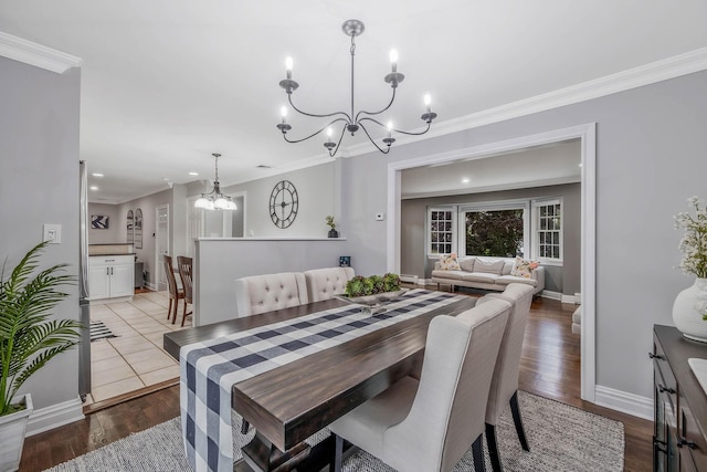 15 Format Ln, Smithtown, NY 11787 - dining space with a chandelier, ornamental molding, wood finished floors, and recessed lighting