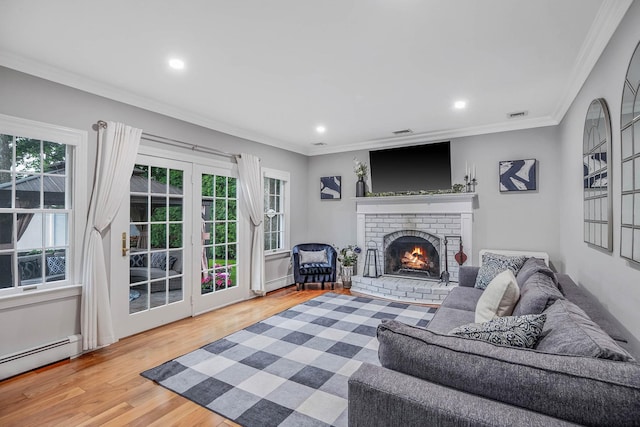 15 Format Ln, Smithtown, NY 11787 - living room featuring a baseboard radiator, crown molding, a fireplace, wood finished floors, and recessed lighting