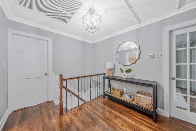 15 Format Ln, Smithtown, NY 11787 - hallway featuring an upstairs landing, attic access, wood finished floors, a chandelier, and ornamental molding