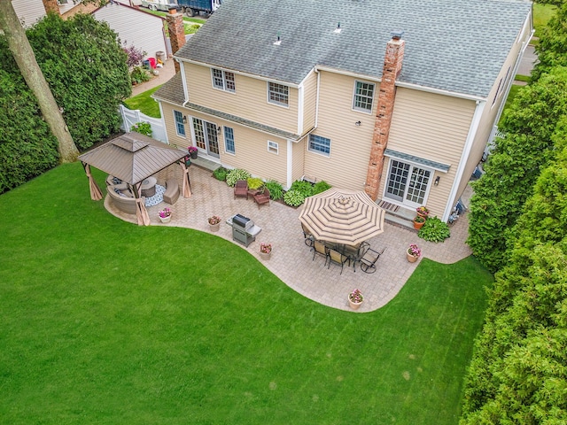 15 Format Ln, Smithtown, NY 11787 - back of property featuring a patio, french doors, outdoor dining area, roof with shingles, and an outdoor living space with a fire pit
