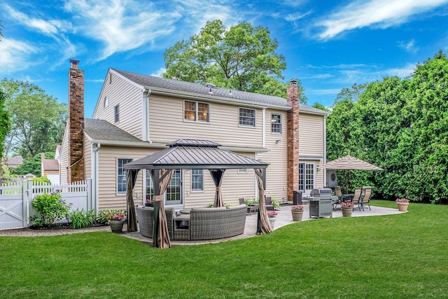 15 Format Ln, Smithtown, NY 11787 - back of house with outdoor lounge area, a gazebo, a chimney, a patio, and a gate