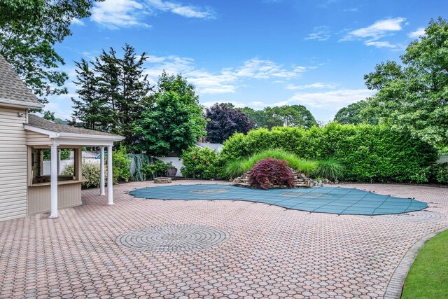 53 Pequot Ln, East Islip, NY 11730 - view of pool featuring a patio and a wooden deck