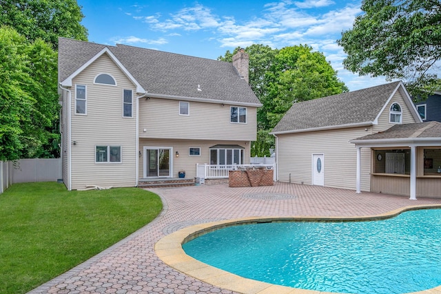 53 Pequot Ln, East Islip, NY 11730 - view of swimming pool featuring a patio and a wooden deck