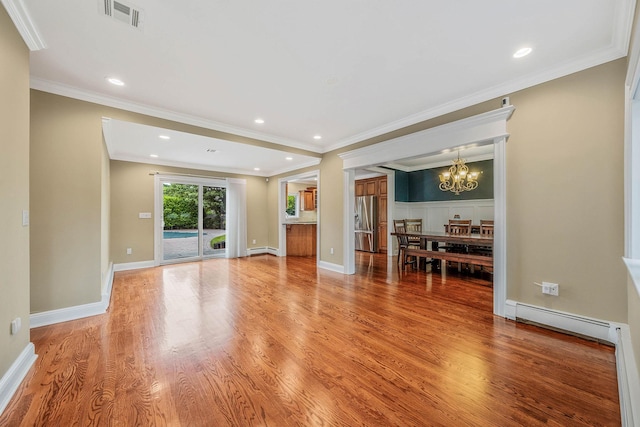 53 Pequot Ln, East Islip, NY 11730 - living room with a baseboard radiator, a chandelier, light wood-type flooring, ornamental molding, and recessed lighting