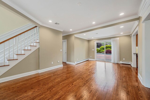 53 Pequot Ln, East Islip, NY 11730 - unfurnished living room with a baseboard heating unit, stairs, wood finished floors, baseboard heating, and recessed lighting