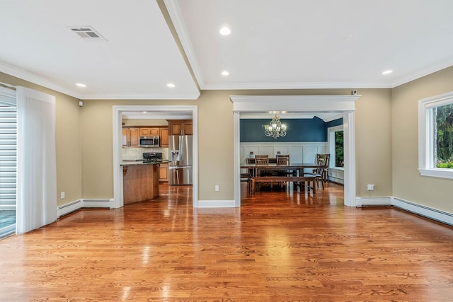 53 Pequot Ln, East Islip, NY 11730 - living area with a chandelier, recessed lighting, light wood-style floors, ornamental molding, and a baseboard heating unit