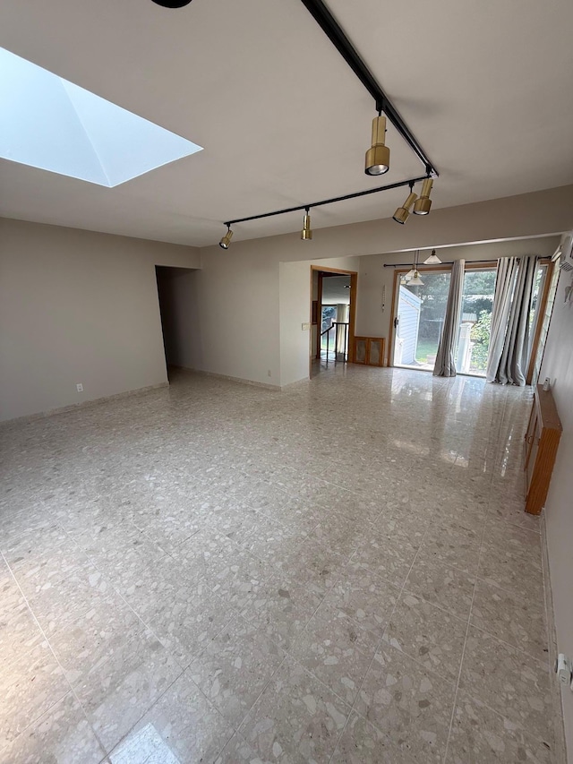 109 Nassau Dr, Albertson, NY 11507 - empty room featuring rail lighting and a skylight