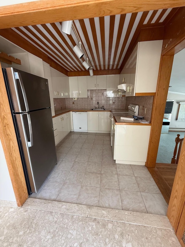 109 Nassau Dr, Albertson, NY 11507 - kitchen featuring freestanding refrigerator, white dishwasher, stove, white cabinetry, and backsplash