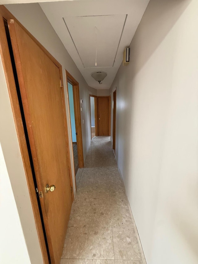 109 Nassau Dr, Albertson, NY 11507 - hallway with attic access and baseboards