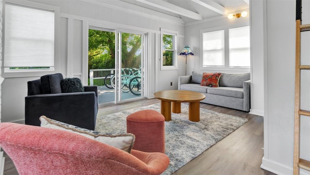 12910 Main Rd, East Marion, NY 11939 - living room featuring beamed ceiling and wood finished floors