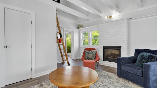 12910 Main Rd, East Marion, NY 11939 - living area featuring a brick fireplace and wood finished floors