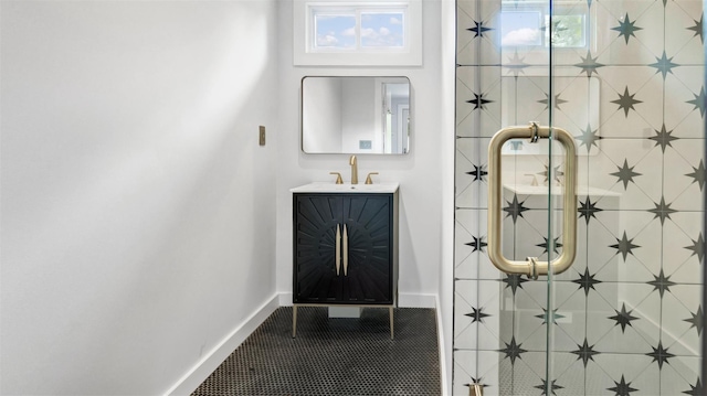 12910 Main Rd, East Marion, NY 11939 - bathroom with healthy amount of natural light, vanity, and tile patterned floors