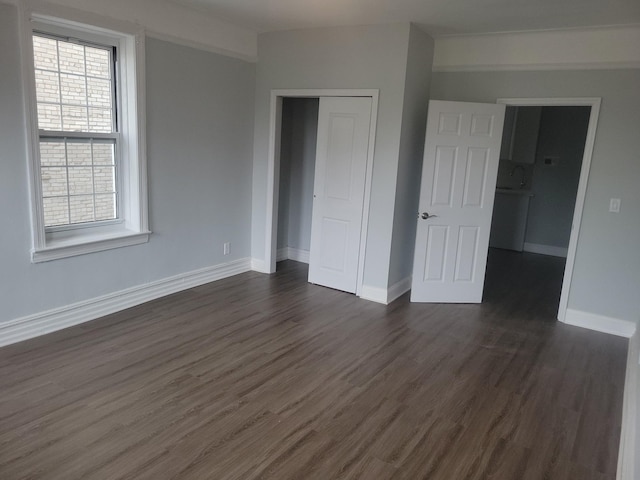 88-11 Elmhurst Ave Unit D15, Elmhurst, NY 11373 - unfurnished bedroom with dark wood finished floors and a closet