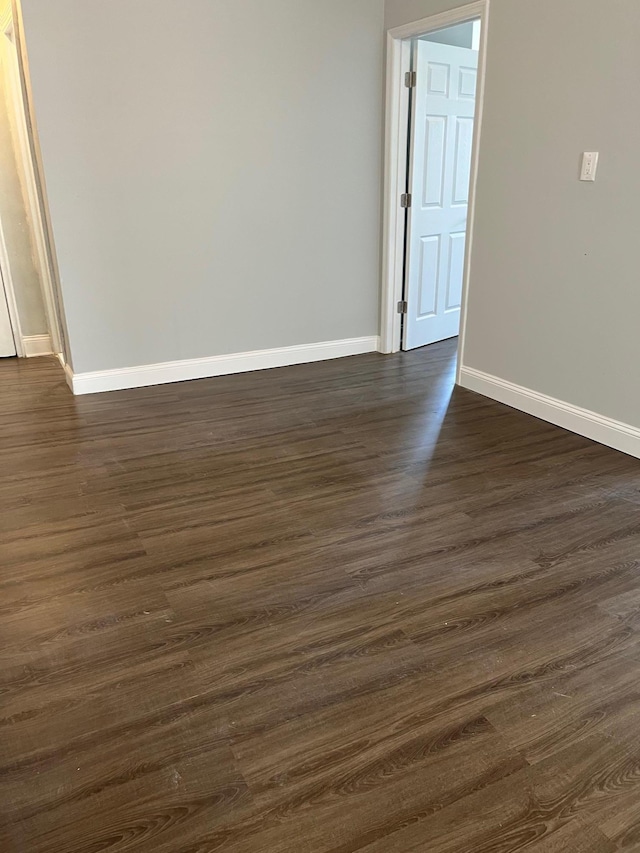 88-11 Elmhurst Ave Unit D15, Elmhurst, NY 11373 - unfurnished room with baseboards and dark wood finished floors