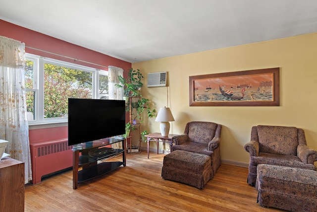 2088 Virgil Pl, Bronx, NY 10473 - living area with radiator heating unit, wood finished floors, and a wall mounted AC