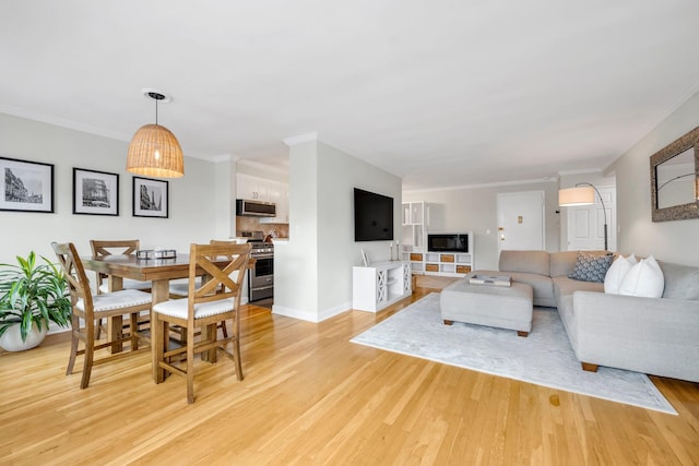 5 Birchwood Ct Unit 2C, Mineola, NY 11501 - living area featuring light wood-type flooring and crown molding