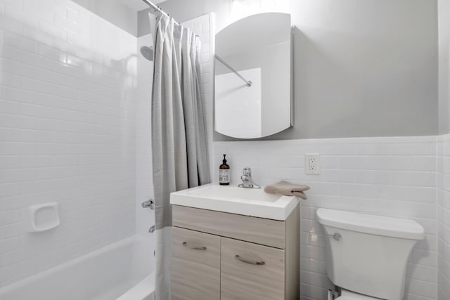 5 Birchwood Ct Unit 2C, Mineola, NY 11501 - bathroom featuring shower / bath combo, vanity, and a wainscoted wall