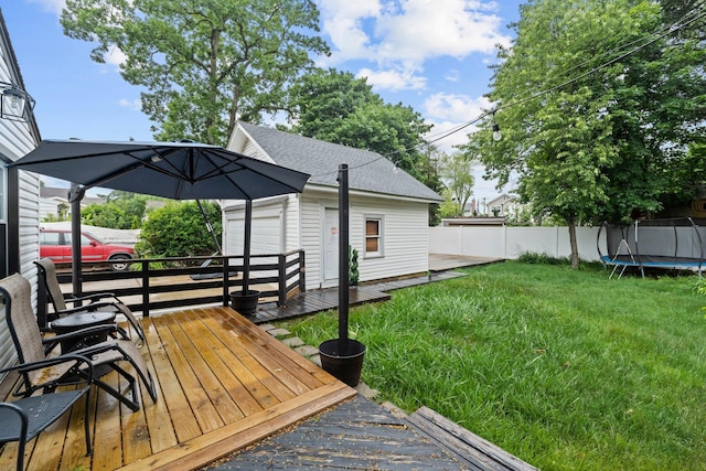 17 Sachem St, East Rockaway, NY 11518 - wooden terrace with a trampoline and an outdoor structure