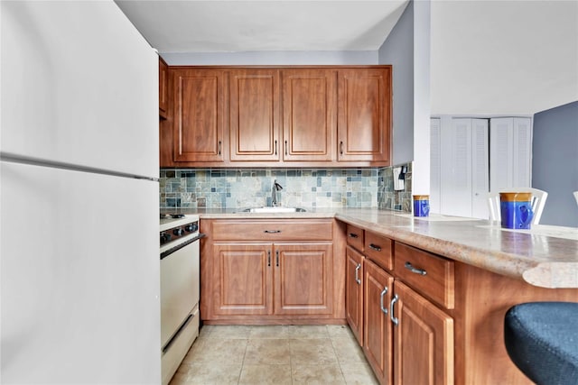 68-15 Selfridge St Unit 5D, Forest Hills, NY 11375 - kitchen featuring white appliances, brown cabinets, tasteful backsplash, and light stone counters