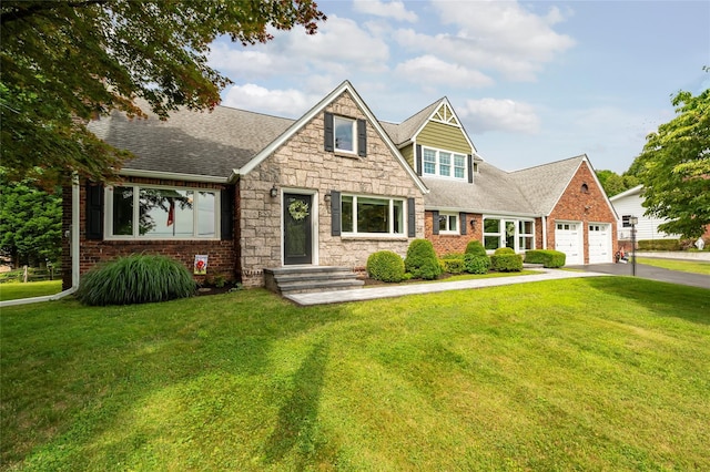 85 Jay St, Stony Point, NY 10980 - view of front of house featuring asphalt driveway, a front lawn, a garage, and roof with shingles