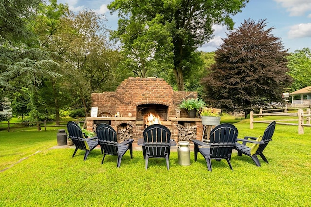 85 Jay St, Stony Point, NY 10980 - view of green lawn with an outdoor brick fireplace and view of wooded area