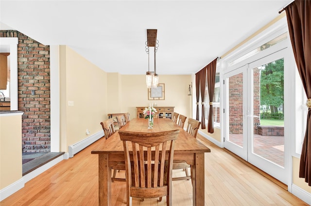 85 Jay St, Stony Point, NY 10980 - dining space with a baseboard radiator and light wood-style flooring