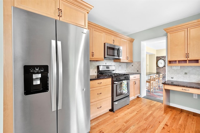 85 Jay St, Stony Point, NY 10980 - kitchen featuring appliances with stainless steel finishes, light brown cabinetry, light wood-type flooring, and tasteful backsplash