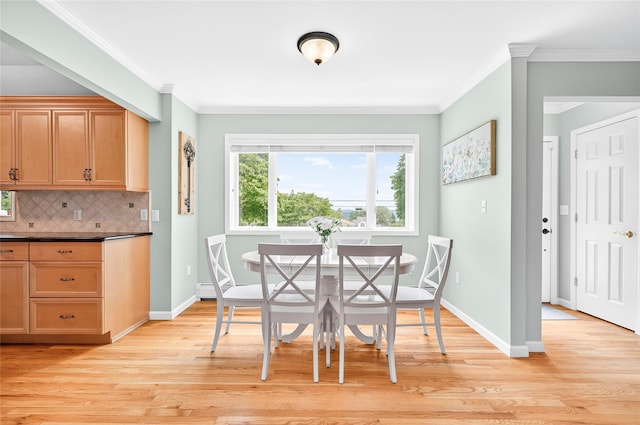 85 Jay St, Stony Point, NY 10980 - dining area with light wood finished floors and ornamental molding