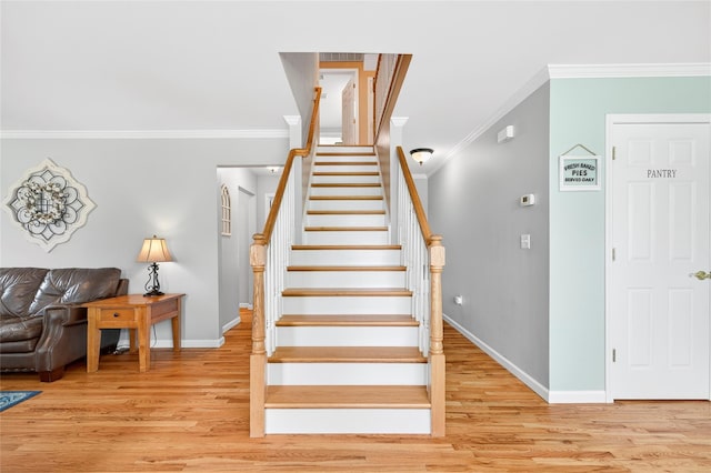 85 Jay St, Stony Point, NY 10980 - stairs featuring crown molding and wood finished floors