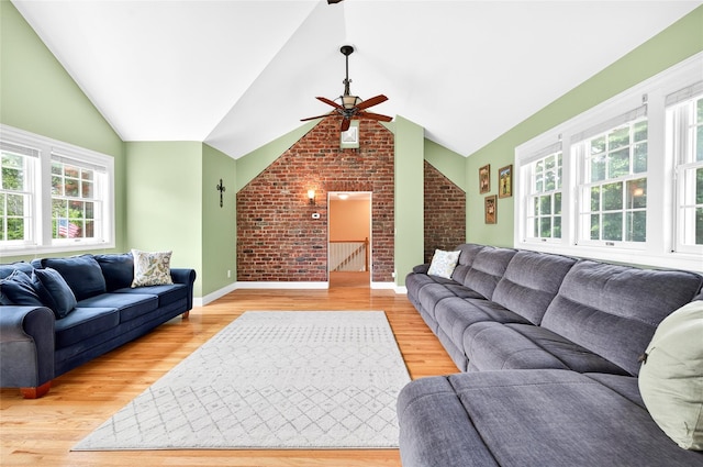 85 Jay St, Stony Point, NY 10980 - living area featuring ceiling fan, vaulted ceiling, brick wall, and light wood-style floors