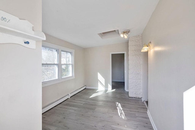 33 N Rte 303, Congers, NY 10920 - empty room featuring baseboard heating and wood finished floors