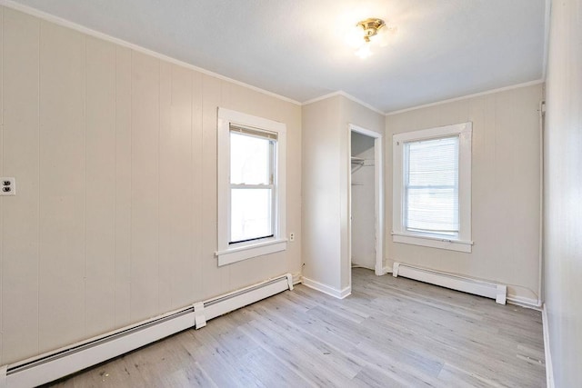 33 N Rte 303, Congers, NY 10920 - unfurnished bedroom with a baseboard radiator, light wood-type flooring, ornamental molding, and a closet