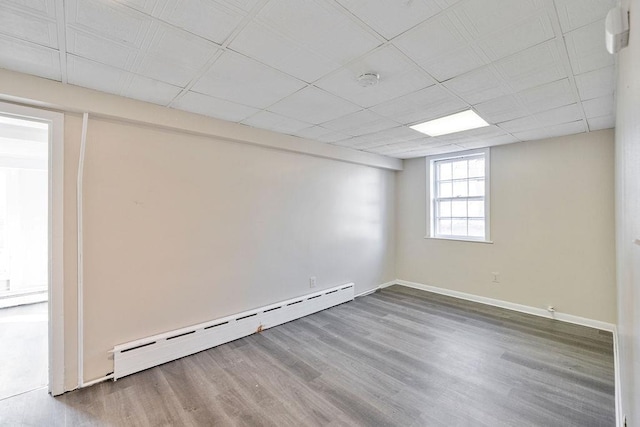 33 N Rte 303, Congers, NY 10920 - spare room with a baseboard heating unit and wood finished floors