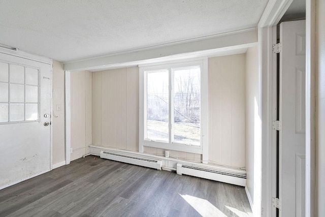 33 N Rte 303, Congers, NY 10920 - entrance foyer with baseboard heating, dark wood-type flooring, and a textured ceiling
