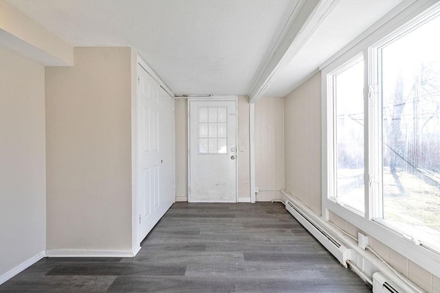 33 N Rte 303, Congers, NY 10920 - entryway featuring baseboard heating, wood finished floors, and a baseboard heating unit