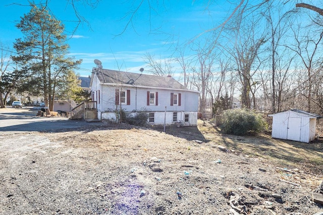 33 N Rte 303, Congers, NY 10920 - view of front of house with a shed and a chimney