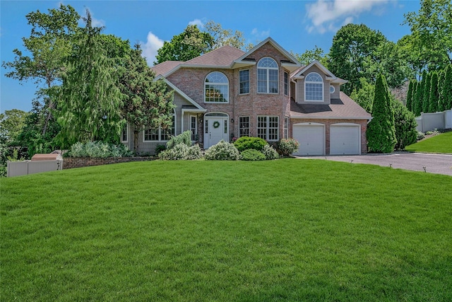 26 Sesame St, Kings Park, NY 11754 - view of front facade with brick siding and driveway