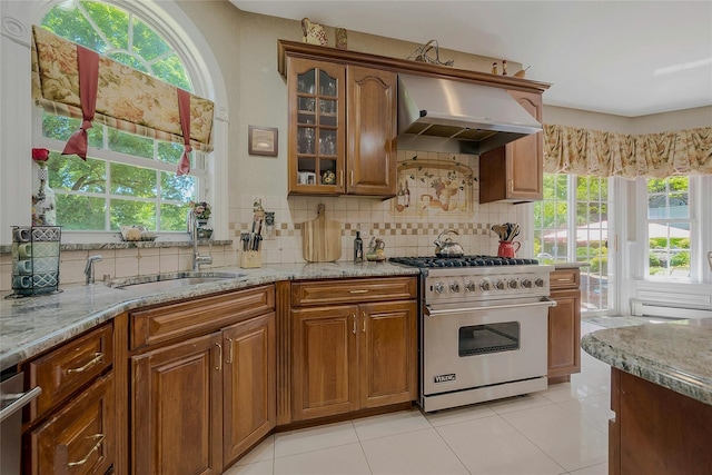 26 Sesame St, Kings Park, NY 11754 - kitchen with appliances with stainless steel finishes, extractor fan, light stone counters, and healthy amount of natural light