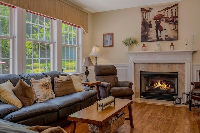 26 Sesame St, Kings Park, NY 11754 - living area with wood finished floors, a premium fireplace, and wainscoting