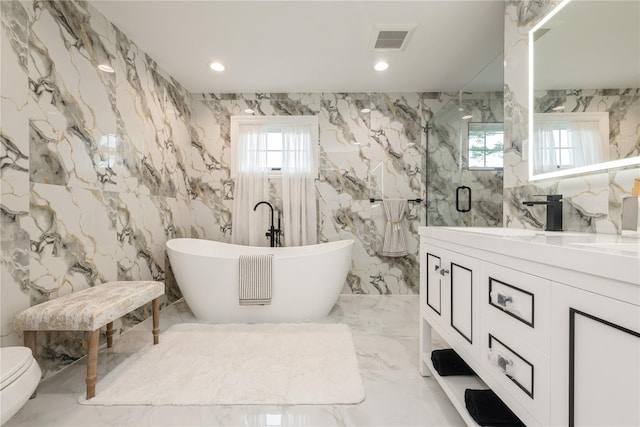 52 Cortland Ave, Hicksville, NY 11801 - full bath featuring marble tiled flooring, healthy amount of natural light, a marble finish shower, a freestanding bath, and recessed lighting