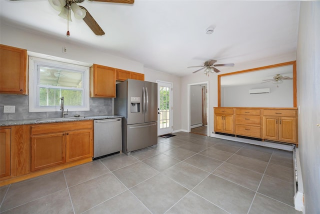 16 Bushwick Rd, Poughkeepsie, NY 12603 - kitchen with appliances with stainless steel finishes, a ceiling fan, a baseboard heating unit, and backsplash