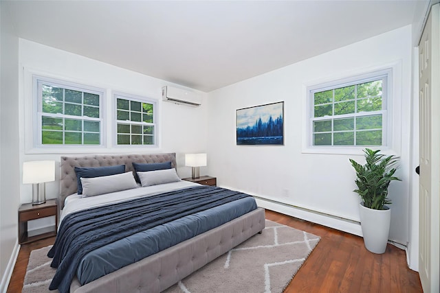 16 Bushwick Rd, Poughkeepsie, NY 12603 - bedroom with an AC wall unit, wood finished floors, and multiple windows