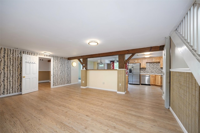 16 Bushwick Rd, Poughkeepsie, NY 12603 - unfurnished living room with light wood-style floors and wallpapered walls