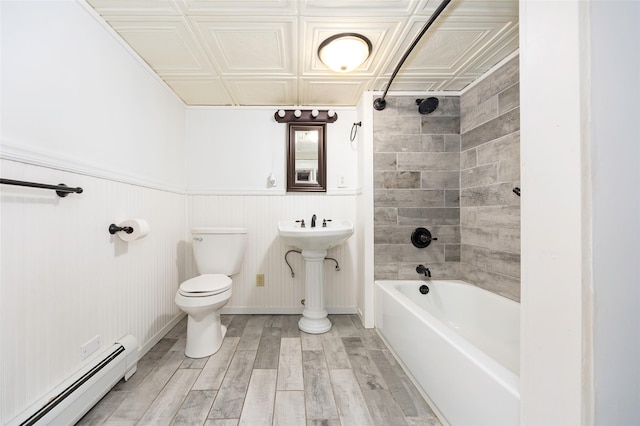 16 Bushwick Rd, Poughkeepsie, NY 12603 - full bathroom with a baseboard heating unit, an ornate ceiling, shower / washtub combination, wood finished floors, and wainscoting