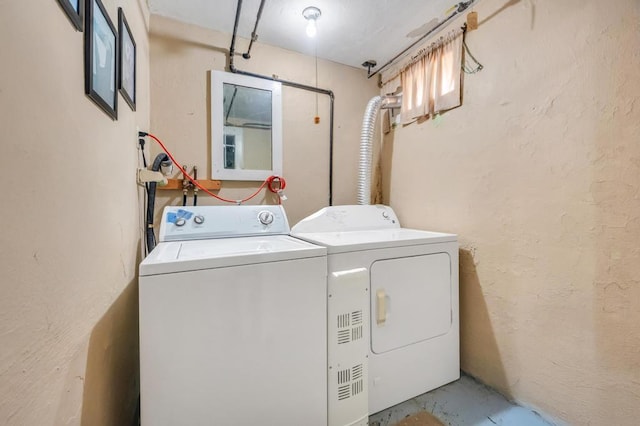 29 E St, Hicksville, NY 11801 - laundry room with washing machine and dryer and a textured wall