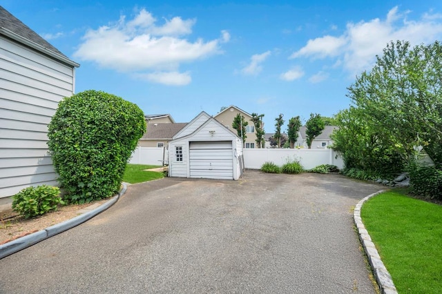 29 E St, Hicksville, NY 11801 - detached garage featuring asphalt driveway