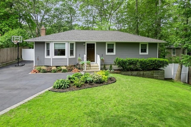 185 Carlton Dr E, Shirley, NY 11967 - ranch-style house featuring a chimney and asphalt driveway