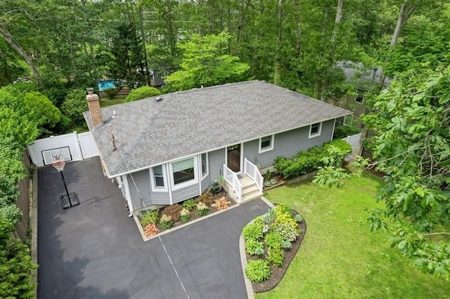 185 Carlton Dr E, Shirley, NY 11967 - view of front of house with roof with shingles, asphalt driveway, a gate, and a chimney