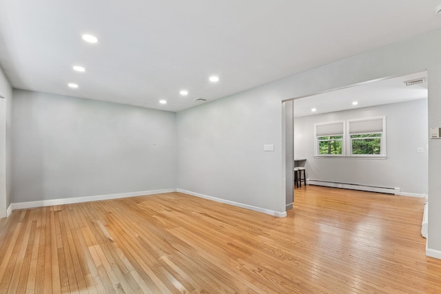 185 Carlton Dr E, Shirley, NY 11967 - spare room with a baseboard radiator, light wood-style floors, and recessed lighting