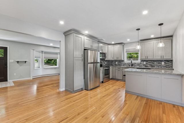 185 Carlton Dr E, Shirley, NY 11967 - kitchen with appliances with stainless steel finishes, gray cabinets, baseboard heating, decorative backsplash, and recessed lighting